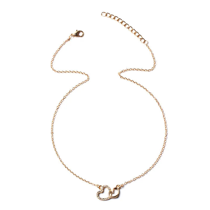 Double Heart Pendant Necklace laid flat showing adjustable gold chain and dual heart charm with zircon accents.