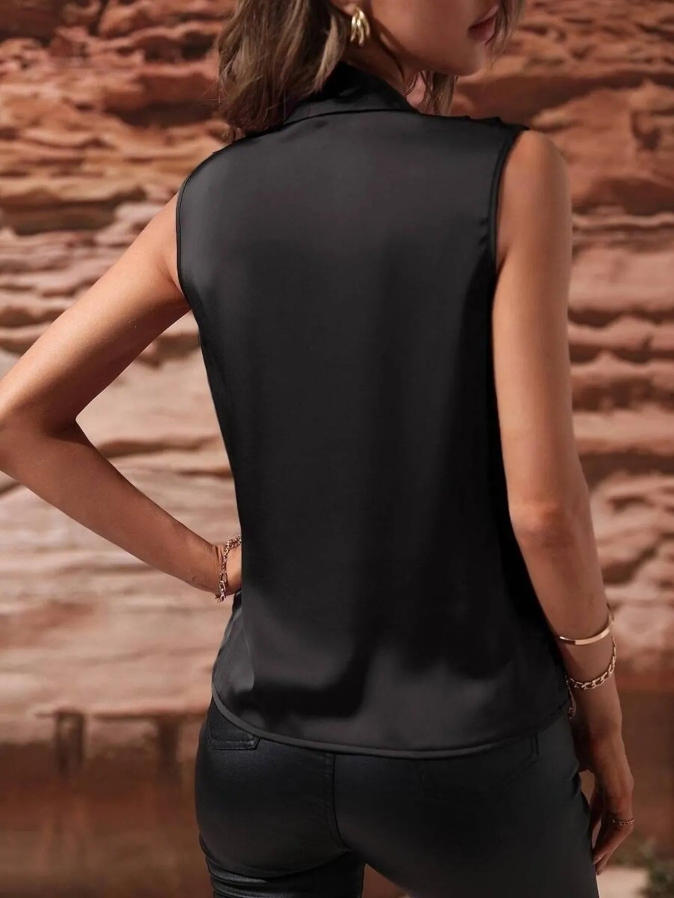 Back view of black Satin Draped Blouse highlighting its smooth satin fabric and tailored fit for a polished look.