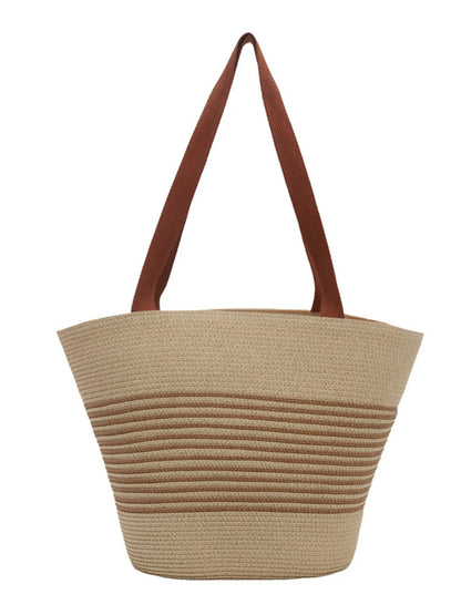 Front view of striped woven medium size tote bag in tan and cream with brown shoulder straps. Minimalist and eco-friendly accessory.