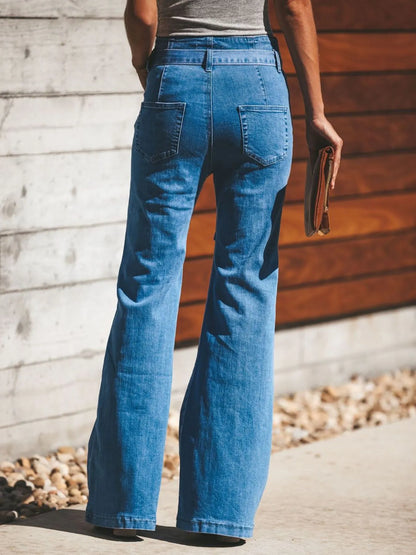 Back view of Women's Tie-Front Flare Jeans with patch pockets and flared legs, offering a flattering fit and retro vibe.
