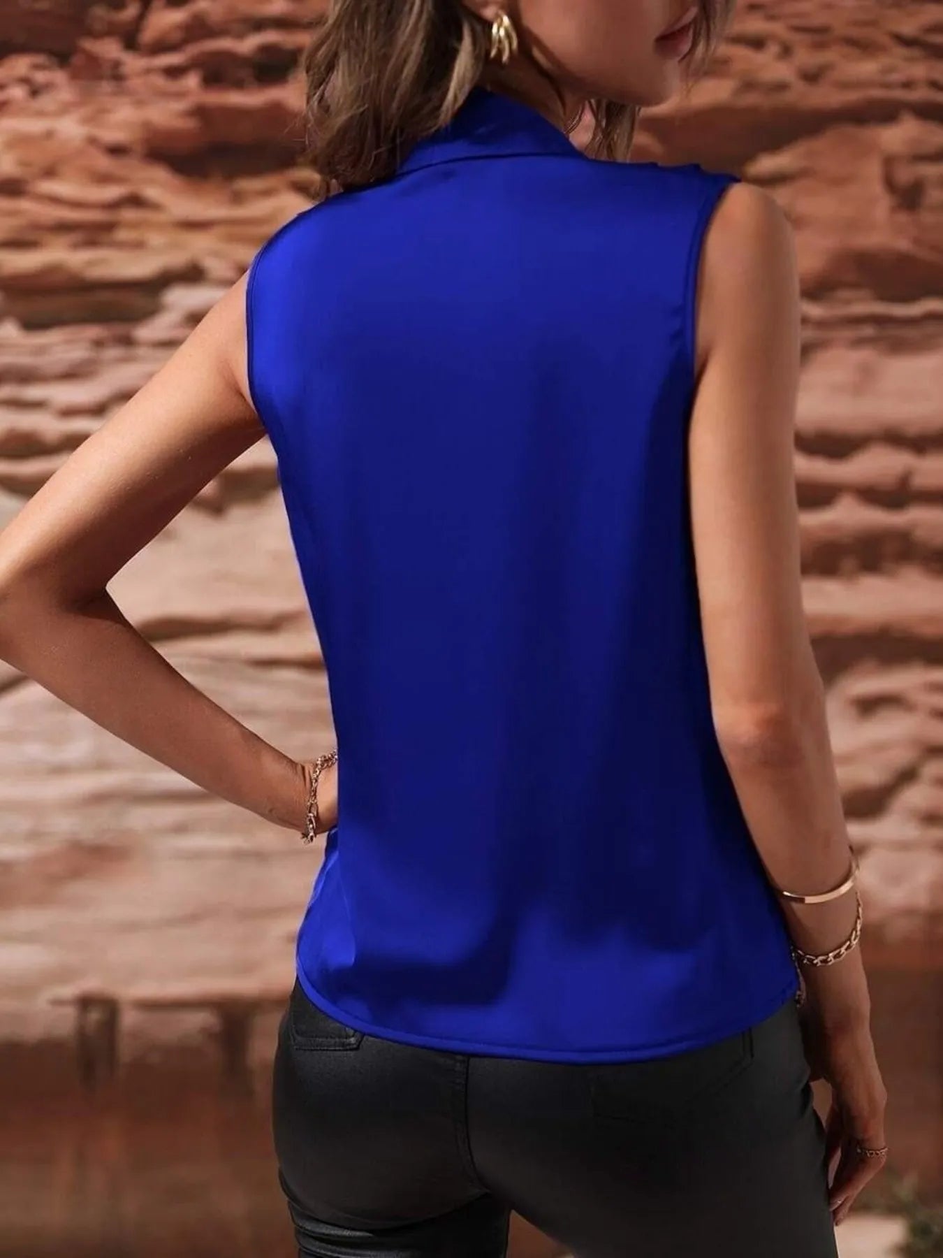 Back view of royal blue Satin Draped Blouse showing sleek satin texture and modern sleeveless silhouette.