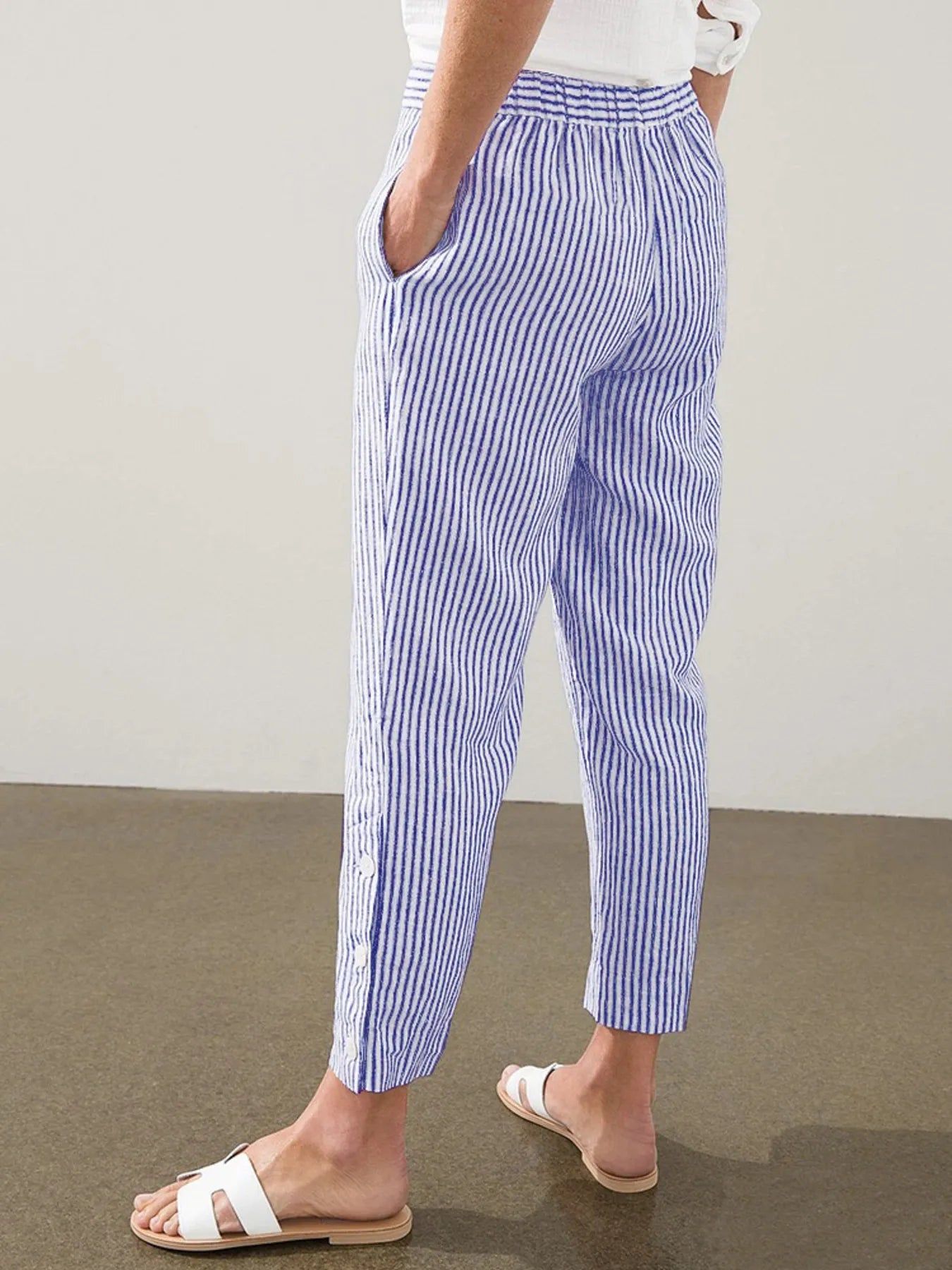 Back view of Madison Striped Button-Hem Pants in blue, showing relaxed fit and elastic waistband. Perfect for resort or casual wear.