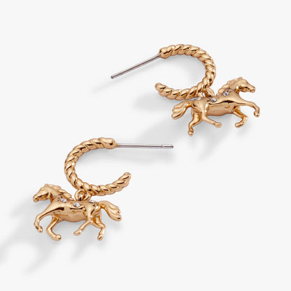 Gold horse-shaped earrings on a white background