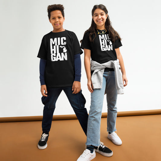 Boldly Michigan youth classic tee in black worn by two kids, showcasing bold white Michigan text design. Ideal unisex t-shirt for casual wear.